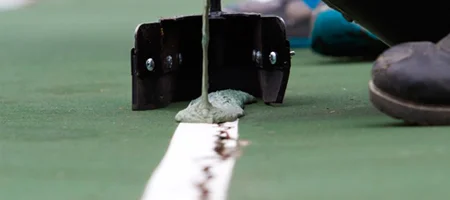 Perbaikan permukaan lapangan olahraga NusaManik