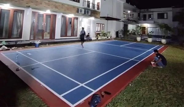Perbaikan lapangan badminton outdoor